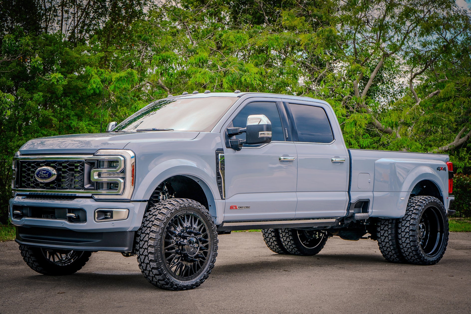 Lifted Ford F-450 Platinum dually on gloss black American Force Plague forged dually wheels with Fury 37x13.50R26 mud-terrain tires