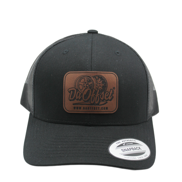 Black Da Offset trucker hat with leather logo patch on white background