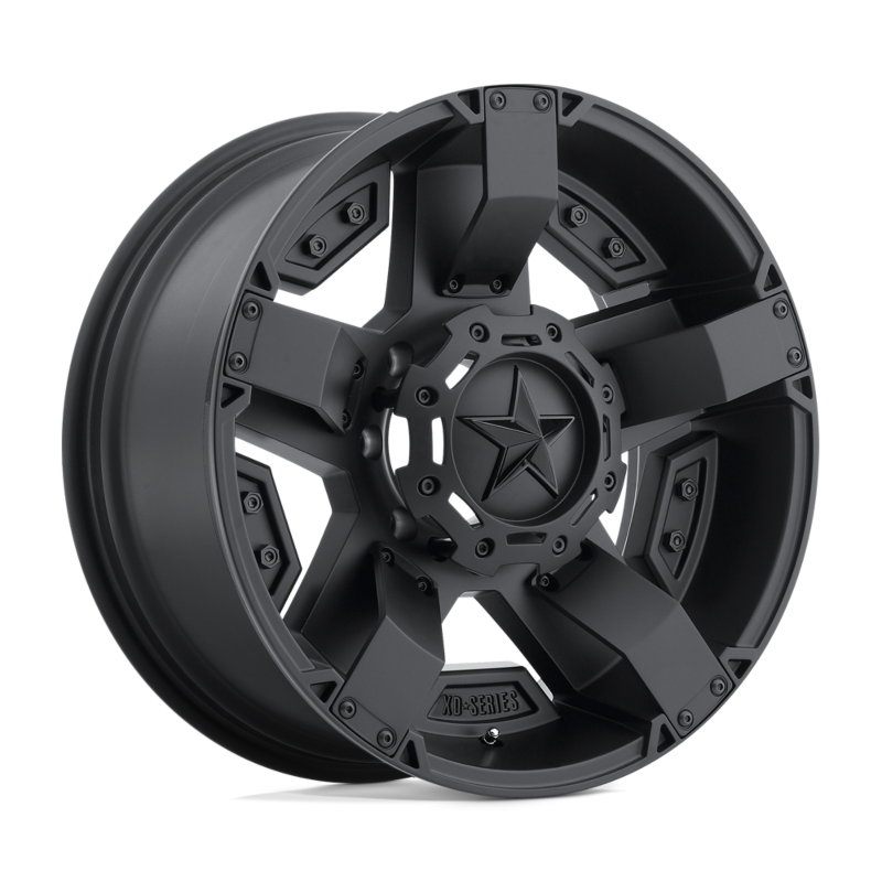 Black alloy wheel with star design on a white background